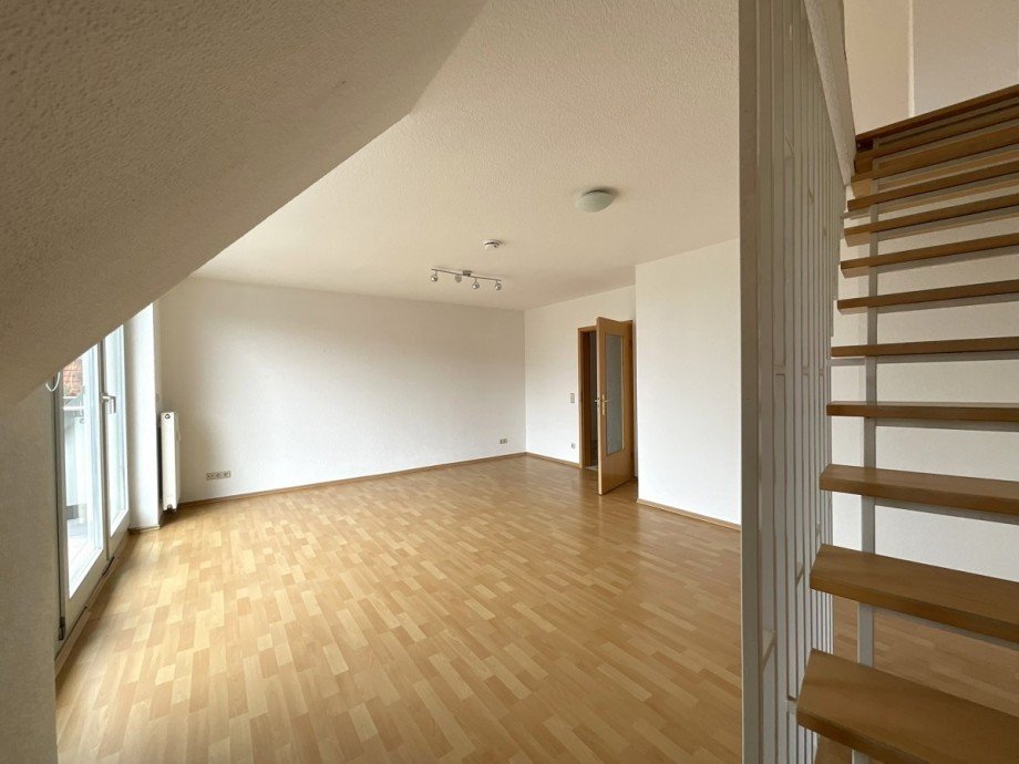 Wohnzimmer mit Treppenlauf Maisonettewohnung Eisenach